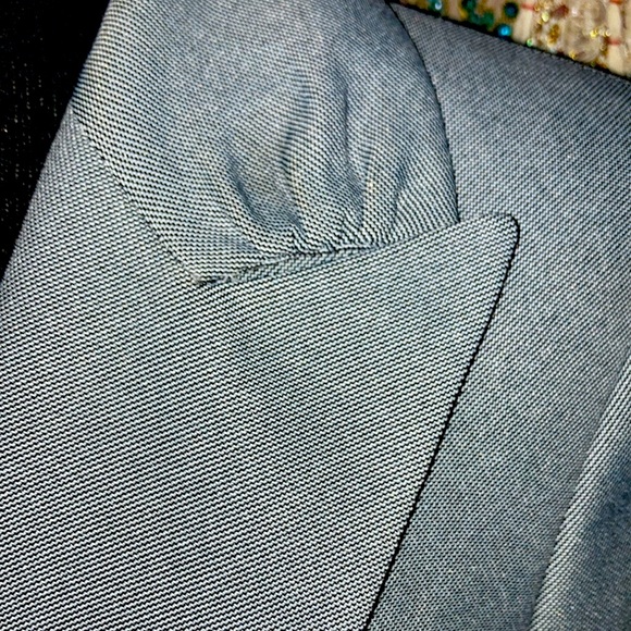 100% Polyester Shell and Lining w/classic black button closure & pleated collar - Picture 2 of 2